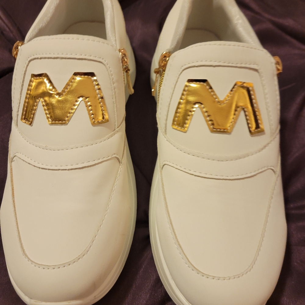 White and gold sneakers